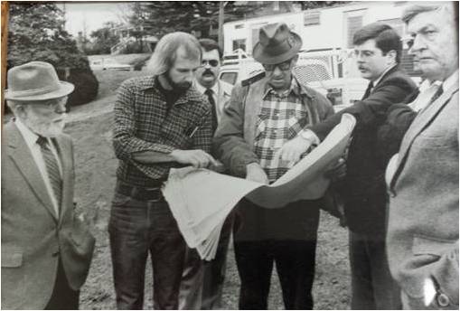 Reviewing the plans of the library building